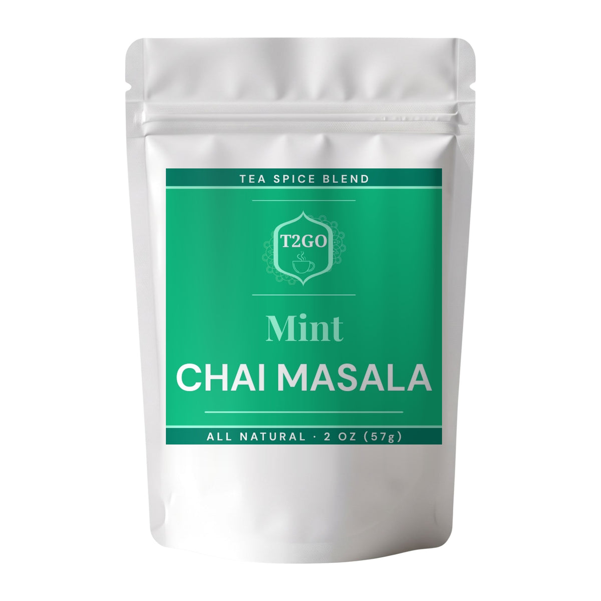 Mint chai masala spice blend in a 2 oz pouch beside a pile of the real ground masala