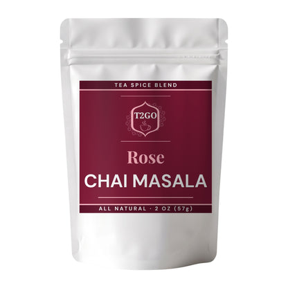 Rose chai masala spice blend in a 2 oz pouch beside a pile of the real ground masala