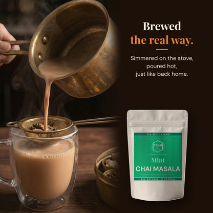 Pouring stovetop masala chai through a strainer, made with Mint chai masala
