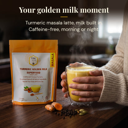 Hands holding a glass mug of turmeric masala golden milk latte next to a T2GO pouch
